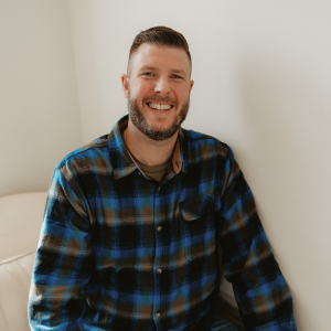 Tim Smith smiling at the camera