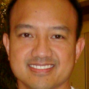 Eric Letada smiling at the camera