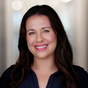 Kaitlyn Kinsey Headshot, smiling in a black blouse 